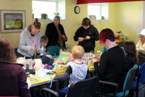 TDC volunteers help with community arts and crafts